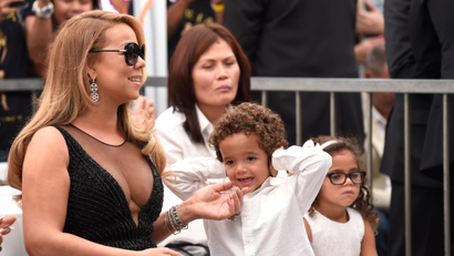 Mariah Carey, from left, Moroccan Cannon, and Monroe Cannon attend a ceremony honoring Mariah Carey with a star on the Hollywood Walk of Fame on Wednesday, Aug. 5, 2015 in Los Angeles. (Photo by Chris Pizzello/Invision/AP)