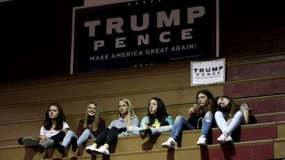 High school students sit in the bleachers of a gymnasium where Republican U.S. presidential nominee Donald Trump was speaking at a campaign rally.