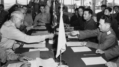Maj. Gen. Blackshear M. Bryan, left, exchanges credentials with Communist Lt. Gen. Lee Sang Cho at the opening session of the Military Armistice Commission at the Panmunjom Conference House on July 27, 1953. At Lee's right is Chinese Gen. Ting Kuo Jo, and next to him is Chinese Gen. Tsai Cheng Wen.