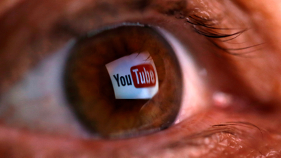 YouTube logo reflected in eye.
