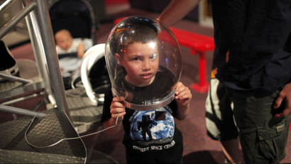 Boy in astronaut helmet
