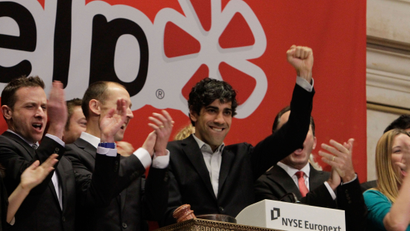 FILE - In this March 2, 2012 file photo, Jeremy Stoppelman, right center, Yelp co-founder and CEO, salutes during opening bell ceremonies of the New York Stock Exchange. The market for initial public offerings is heating up this spring as a better economic outlook and rising stock market help more companies go public. In the weeks before Facebook's massive IPO, two companies have already notched the biggest debuts since LinkedIn went public in May. Congress, meanwhile, is lessening restrictions on IPOs to make it easier for smaller companies to raise money. The IPO comeback may finally be happening. (AP Photo/Richard Drew, File)
