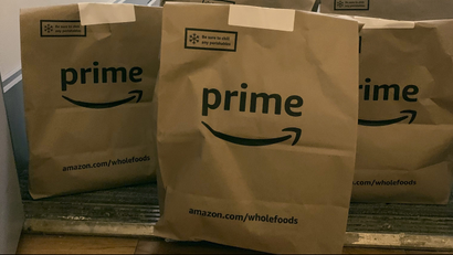 A delivery of groceries from Whole Foods is dropped at a customer's apartment door by Amazon Prime during the coronavirus pandemic
