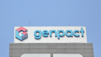The logo of Genpact is seen on the facade of its building in Bengaluru