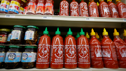 Bottles of Sriracha hot chili sauce, made by Huy Fong Foods, are seen on a supermarket shelf in San Gabriel, California October 30, 2013. REUTERS/Lucy Nicholson (UNITED STATES - Tags: BUSINESS FOOD) - RTX14UG6