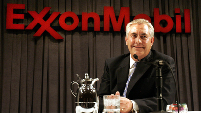 Exxon Mobil Corp. chairman and chief executive Rex W. Tillerson smiles while speaking to reporters during a news conference after the shareholders meeting in Dallas, Wednesday, May 31, 2006.