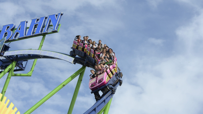 Visitors enjoy a rollercoaster ride in Munich.