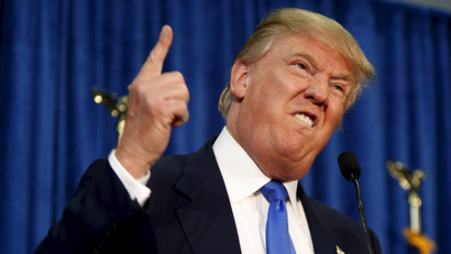 Republican presidential candidate Donald Trump gestures and declares "You're fired!" at a rally in Manchester, New Hampshire, June 17, 2015.