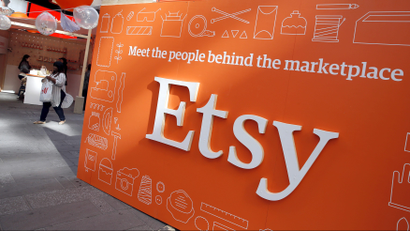 A sign advertising the online seller Etsy Inc. is seen outside the Nasdaq market site in Times Square following Etsy's initial public offering