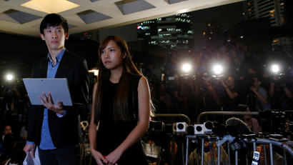 Democratically-elected legislators Yau Wai-Ching and Baggio Leung (L) speak to media after a High Court disqualified them from taking office in Hong Kong, China November 15, 2016. REUTERS/Tyrone Siu - RTX2TQZ5