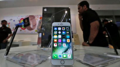An iPhone is seen on display at a kiosk at an Apple reseller store in Mumbai