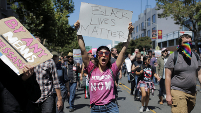 A woman holds a Black Lives Matter sign while marching in a counter protest to a cancelled right-wing rally in San Francisco, California, U.S. two years ago.