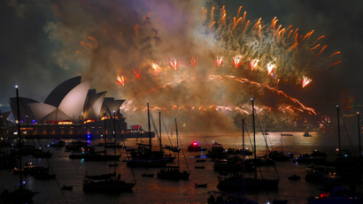Fireworks light up the Sydney Harbour Bridge and Sydney Opera House during new year celebrations on Sydney Harbour
