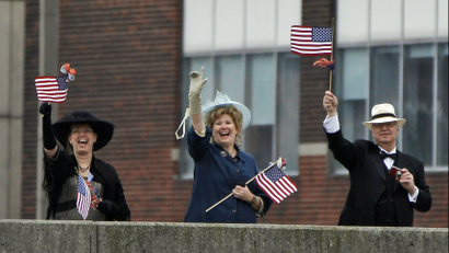 People waving American flags