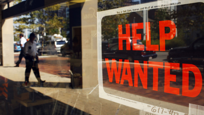 A "Help Wanted" sign in the window advertises a job opening at a dry cleaners in Boston, Massachusetts September 1, 2010. REUTERS/Brian Snyder (UNITED STATES - Tags: BUSINESS EMPLOYMENT)