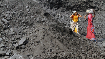 Women work at a coal mine in India.