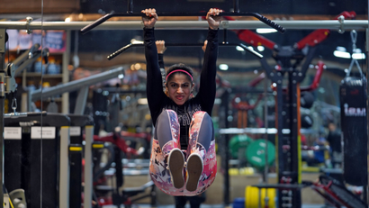 Fitness instructor Fatema Dhoondia exercises inside a gym in Mumbai