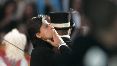 Indian Bollywood actor Shahrukh Khan blows a kiss as he enters the Arena Stadium in Amsterdam.