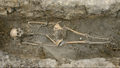 A skeleton is seen at the dig site of tomb in Usme, south of Bogota April 21, 2008.