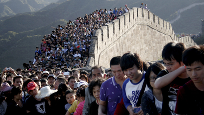 Tourists gather on the Great Wall outside Beijing