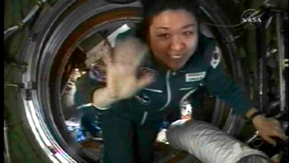 Spaceflight participant So-yeon Yi of Korea enters the International Space Station in this image from NASA TV April 10, 2008. Spaceflight participant Yi will return to Earth April 19th with Expedition 16 crew members, Commander Peggy Whitson and Flight Engineer Yuri Malenchenko.