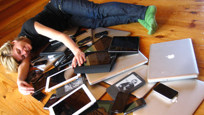 laptops and mobile devices on the floor.