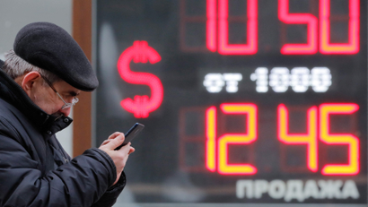 An outdoor board showing currency exchange rates of U.S. dollar against the Russian rouble in Saint Petersburg, Russia