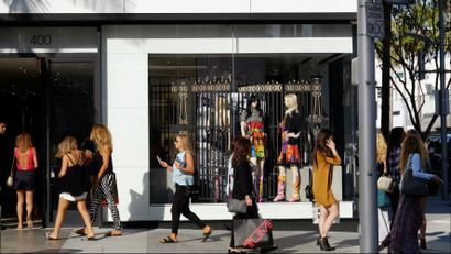 Shoppers walk past the Chanel Boutique on Rodeo Drive in Beverly Hills, California.