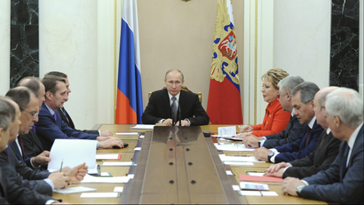 Russian President Vladimir Putin (C) chairs a meeting with members of the Security Council at the Kremlin in Moscow March 6, 2015.