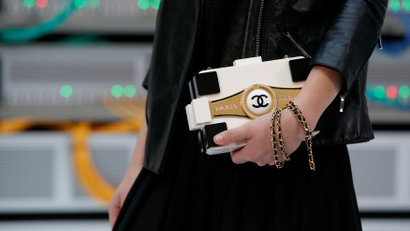 The Chanel logo is seen on a handbag before the Spring/Summer 2017 women's ready-to-wear collection for fashion house Chanel during Fashion Week in Paris, France October 4, 2016. REUTERS/Gonzalo Fuentes