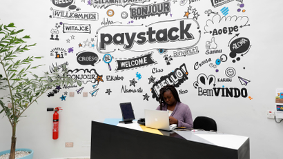A woman sits at the front desk inside Paystack's offices in Lagos, Nigeria