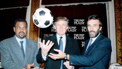 Real estate magnate Donald Trump is flanked by soccer players Luis Pereira, left, of Brazil, and Julio Villa of Argentina, during a news conference in New York, Jan. 29, 1992. Argentina and Brazil will meet in an exhibition Futbol 5 match at Trump Plaza Hotel and Casino in Atlantic City, N.J., March 28, 1992.
