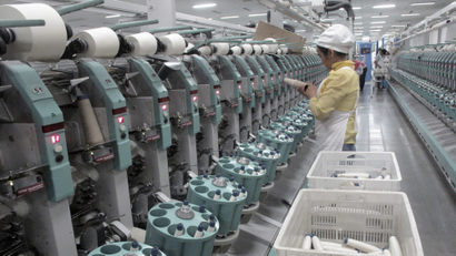 A worker is seen in Youngor's cotton spinning factory, in Aksu, Xinjiang Uighur Autonomous Region