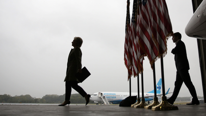 Hillary Clinton boards a plane