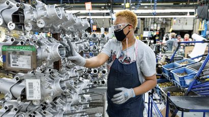 A person works on a Polaris ATV assembly line at their manufacturing and assembly plant.