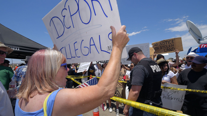 A woman protest undocumented immigrants