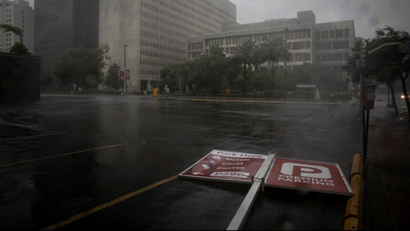 A parking sign lies in the street as Hurricane Ida makes landfall in Louisiana, in New Orleans