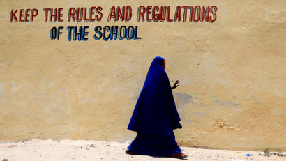 A pupil walks past a classroom at the Hamar boarding school in Somalia's capital Mogadishu, April 2, 2012. Somalia has been beset by conflict since 1991 and different regions are variously controlled by Islamist groups, clan militias or the weak transitional government.