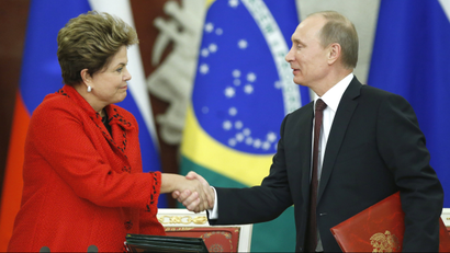 Russian President Vladimir Putin and Brazilian President Dilma Rousseff shake hands during a signing ceremony in the Kremlin in Moscow .