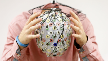 Test subject in an electroencephalography (EEG) cap