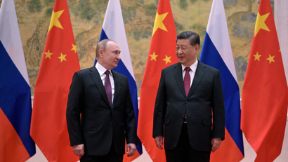 Russian President Vladimir Putin meets Chinese President Xi Jinping.