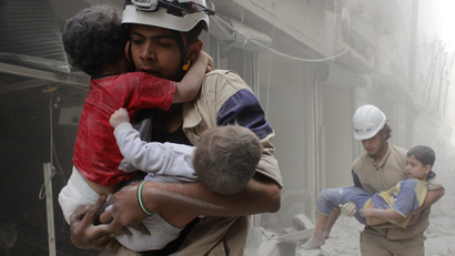 Members of the Civil Defence, The White Helmets, rescue children in Aleppo