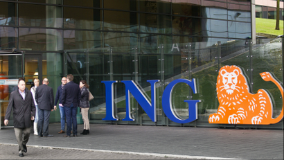 Employees of ING group take a break in front of their office in Amsterdam