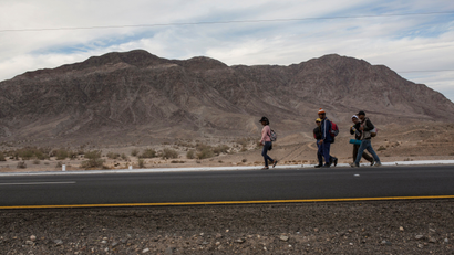 Central American migrants from Honduras, part of the Central American migrant caravan, walk along the highway that connects Mexicali with Tijuana