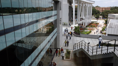 Indian software services firm Wipro Ltd. employees walk inside the company campus in Bangalore, India