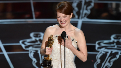 Julianne Moore accepts the award for best actress in a leading role for Still Alice" at the Oscars on Sunday, Feb. 22, 2015, at the Dolby Theatre in Los Angeles. (Photo by John Shearer/Invision/AP)
