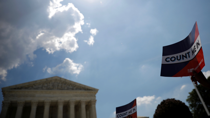 A protester holds sign outside the U.S. Supreme Court in Washington