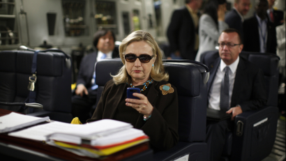 hilary clinton checking phone email