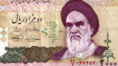 This image, taken by an individual not employed by the Associated Press and obtained by the AP outside Iran, is a scan made Monday, Jan. 11, 2010 of a 2,000 rial Iranian banknote showing the Islamic Republic's revered founder Ayatollah Ruhollah Khomeini anda handwritten pro-opposition graffiti in Farsi in green reading "We are countless" and showing the "V" for victory sign. Facing hard-line forces on the streets, Iran's anti-government demonstrators have taken their protests to a new venue: writing opposition slogans on bank notes, while officials scramble to yank the bills from circulation.