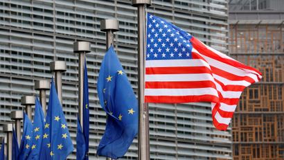 US and European Union flags at the European Commission headquarters in Brussels.
